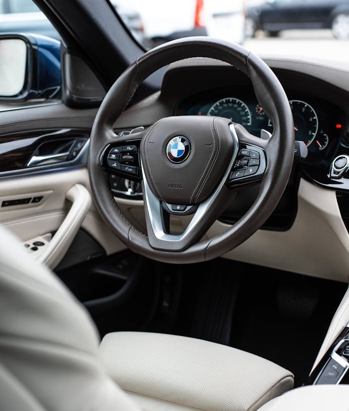 Portfolio Steering Wheel And Dashboard In The Bmw 5 Series With White Leather Upholstery 12175733 E1765811889982